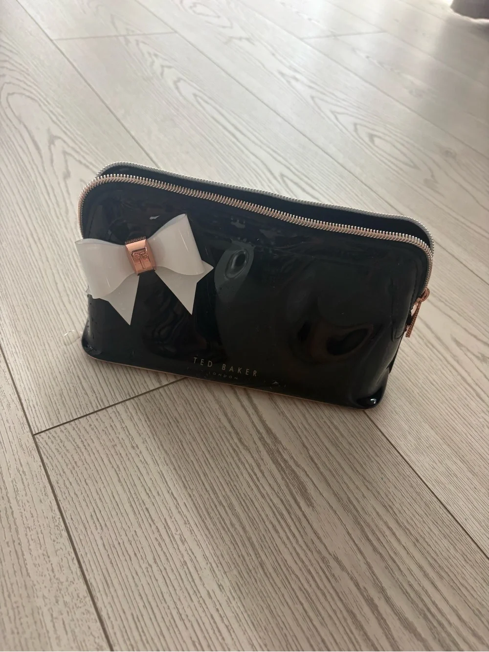 Ted Baker Black Patent Cosmetic Pouch with White Bow and Rose Gold Trim
